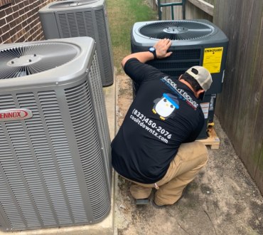 A Cool It Down technician diagnosing an outdoor AC unit at a home